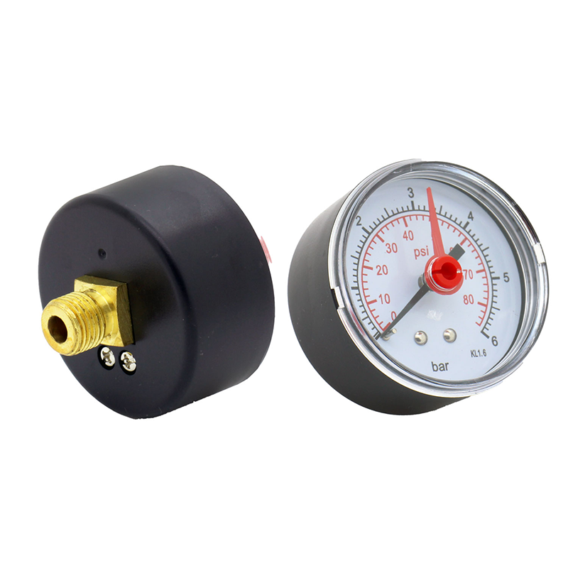 Pressure gauge with black body and brass fitting on a white background