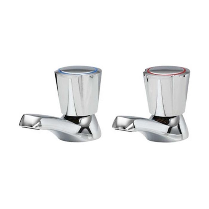 Pair of chrome bathroom faucets on a white background