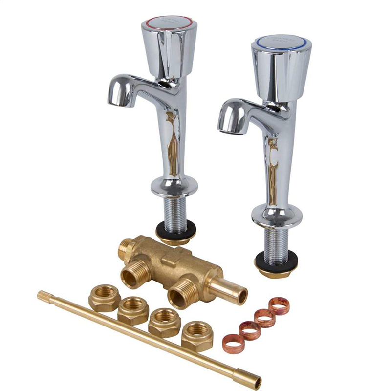 Chrome beer taps and brass plumbing components on a white background