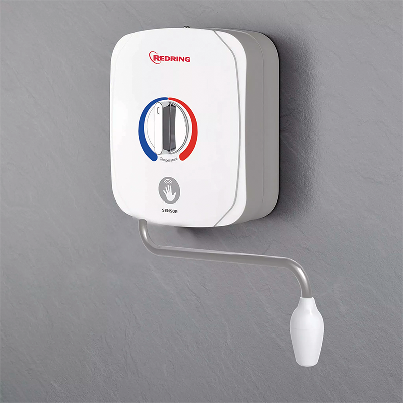 White wall-mounted hand wash with red and blue accents on a gray background