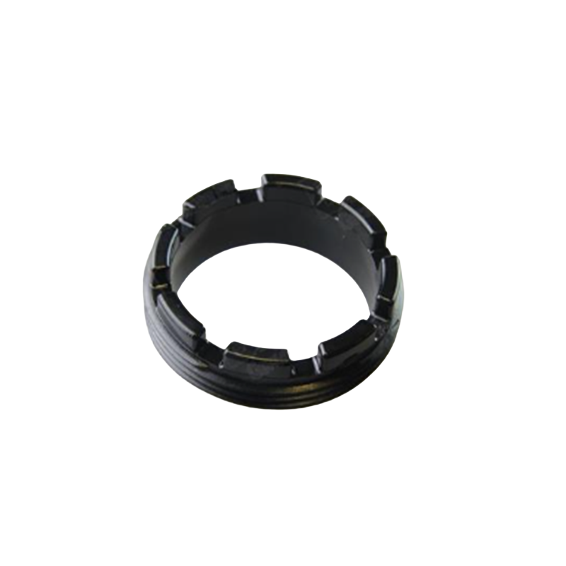 Black plastic ring component on a white background