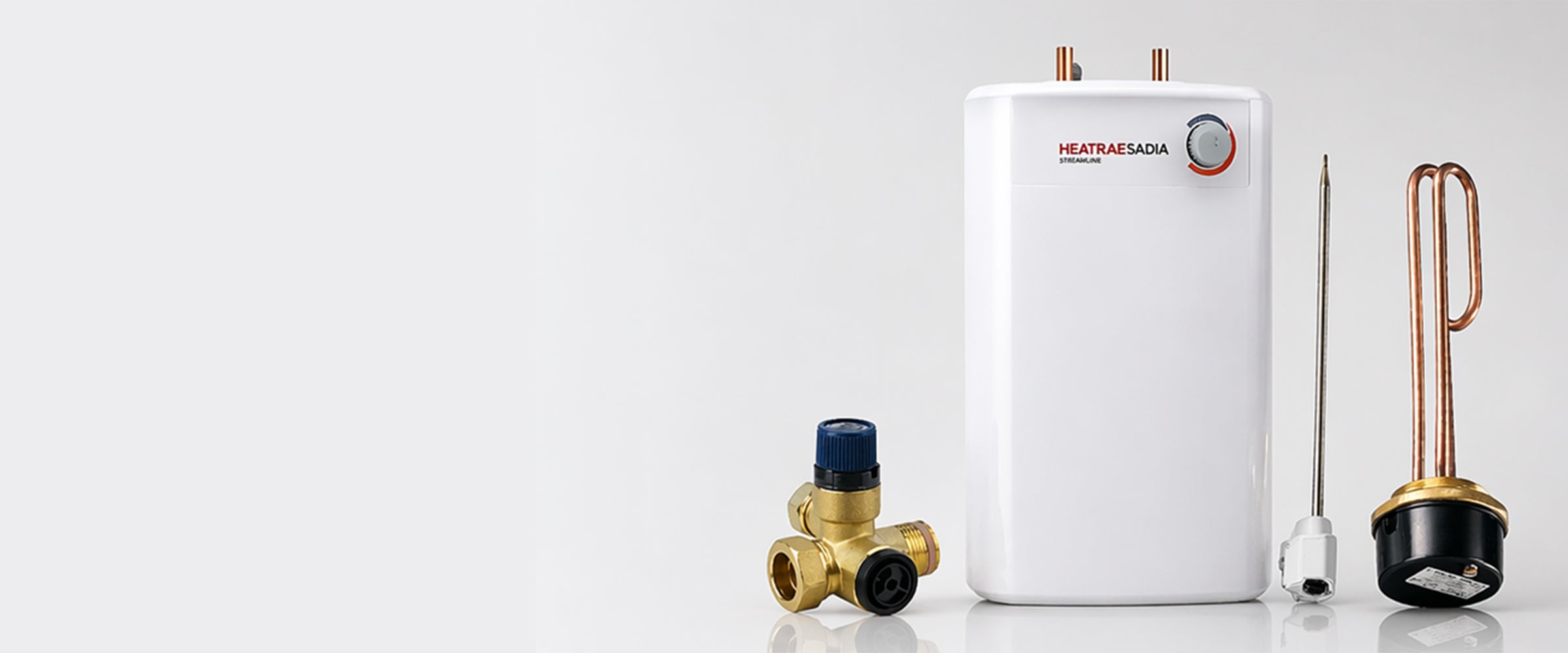White water heater with plumbing components on a light gray background